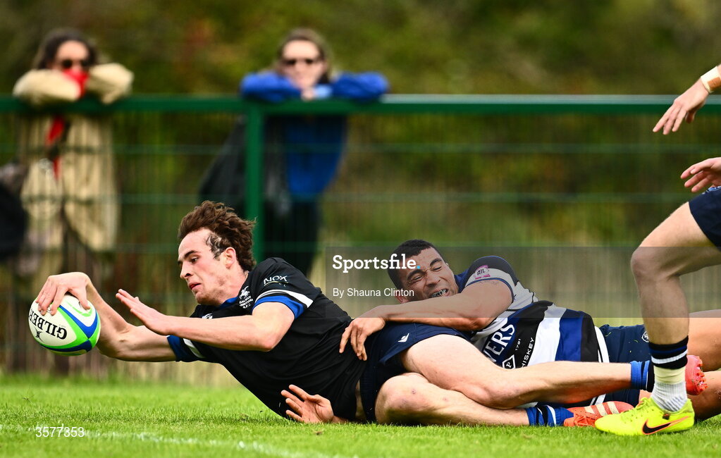 26 September 2026; Ned Williams of Galway Corinthians scores his side's first try despite the efforts of Jordan Conroy of Wanderers during the Energia Men's All-Ireland League Division 2A match between Galway Corinthians and Wanderers at Dangan Sportground in Galway. Photo by Shauna Clinton/Sportsfile