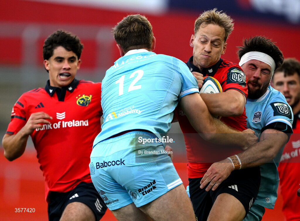 26 September 2026; Mike Haley of Munster is tackled by Stafford McDowall and Ally Miller of Glasgow Warriors during the United Rugby Championship match between Munster and Glasgow Warriors at Thomond Park in Limerick. Photo by Brendan Moran/Sportsfile