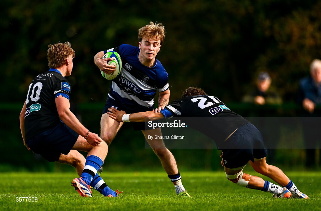 26 September 2026; Sean Sexton of Wanderers in action against Galway Corinthians players Billy Cross, left, and Joey Tierney during the Energia Men's All-Ireland League Division 2A match between Galway Corinthians and Wanderers at Dangan Sportground in Galway. Photo by Shauna Clinton/Sportsfile