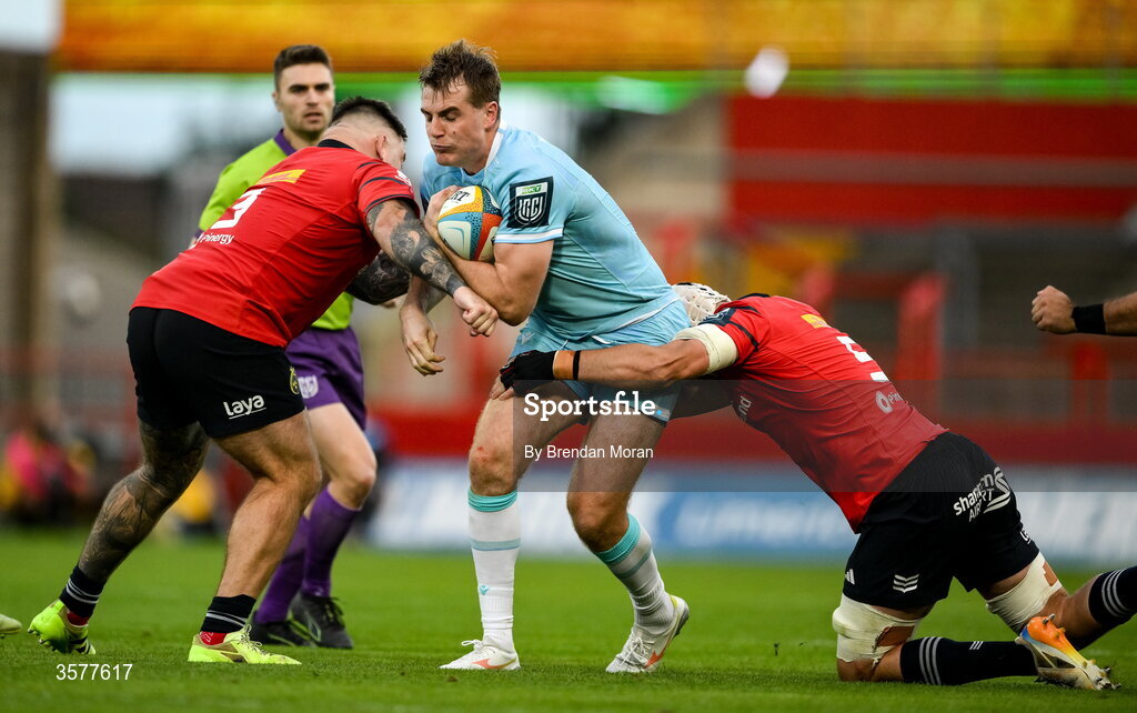 26 September 2026; Stafford McDowall of Glasgow Warriors is tackled by Kieran Brookes and Fineen Wycherley of Munster during the United Rugby Championship match between Munster and Glasgow Warriors at Thomond Park in Limerick. Photo by Brendan Moran/Sportsfile
