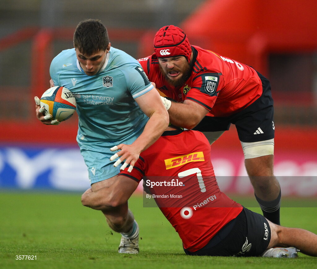 26 September 2026; Rory Darge of Glasgow Warriors is tackled by Alex Kendellen and Marnus van der Merwe of Munster during the United Rugby Championship match between Munster and Glasgow Warriors at Thomond Park in Limerick. Photo by Brendan Moran/Sportsfile