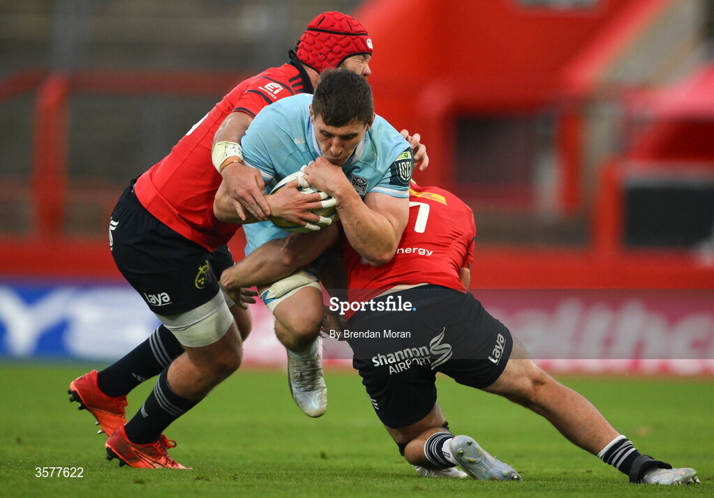 26 September 2026; Rory Darge of Glasgow Warriors is tackled by Alex Kendellen and Marnus van der Merwe of Munster during the United Rugby Championship match between Munster and Glasgow Warriors at Thomond Park in Limerick. Photo by Brendan Moran/Sportsfile