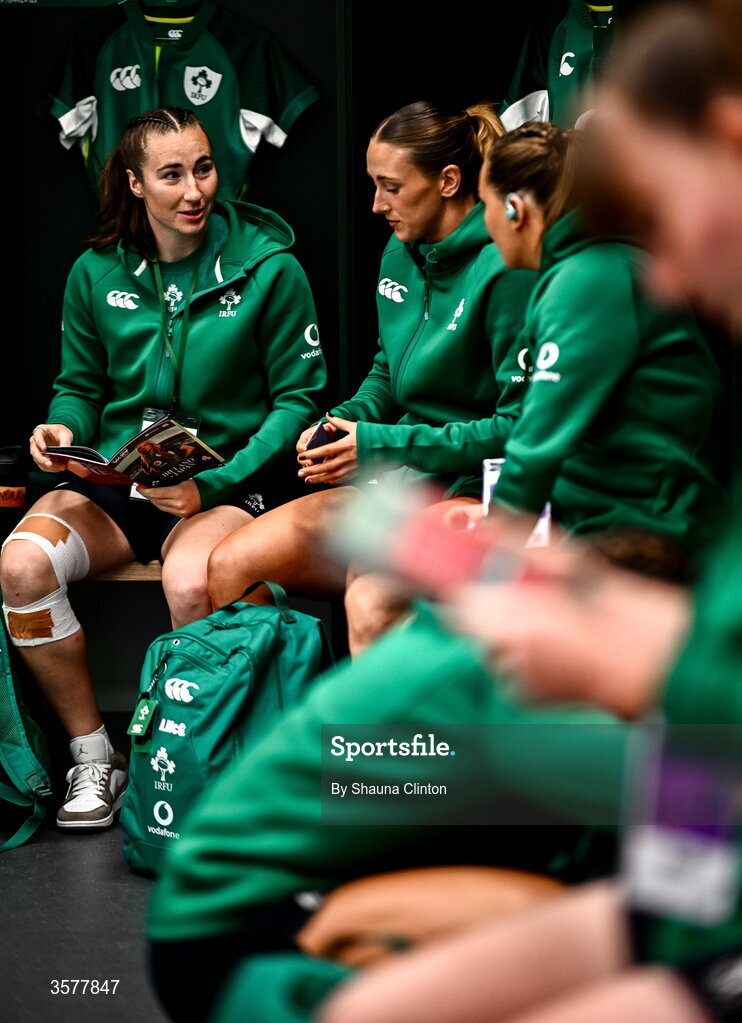 27 September 2026; Eve Higgins, left, Anna McGann and teammates in the Ireland dressingroom before the WXV Global Series match between Ireland and Japan at Dexcom Stadium in Galway. Photo by Shauna Clinton/Sportsfile