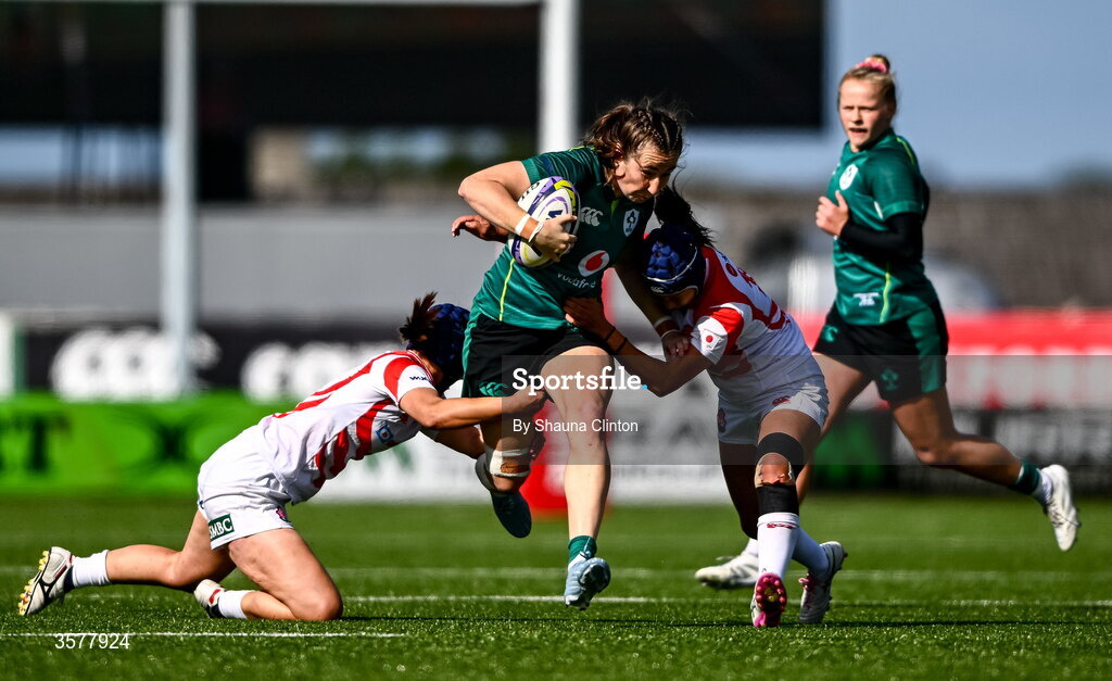 27 September 2026; Eve Higgins of Ireland is tackled by Uta Kataoka, left, and Sawa Harada of Japan during the WXV Global Series match between Ireland and Japan at Dexcom Stadium in Galway. Photo by Shauna Clinton/Sportsfile