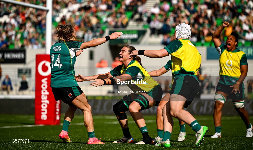 27 September 2026; Béibhinn Parsons of Ireland, left, celebrates with teammates Jane Clohessy and Beth Buttimer after scoring their side's third try, equalling the record of Alison Miller,  during the WXV Global Series match between Ireland and Japan at Dexcom Stadium in Galway. Photo by Shauna Clinton/Sportsfile