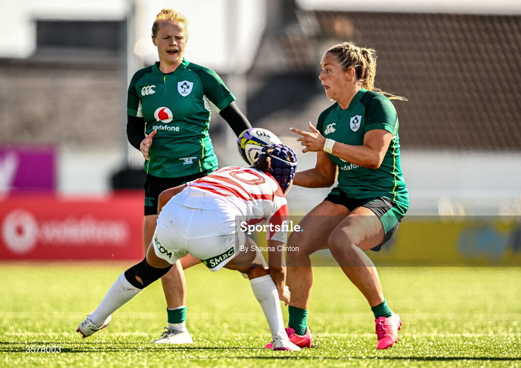 27 September 2026; Stacey Flood of Ireland offloads to teammate Dannah O'Brien, left, as Sawa Harada of Japan comes to tackle during the WXV Global Series match between Ireland and Japan at Dexcom Stadium in Galway. Photo by Shauna Clinton/Sportsfile