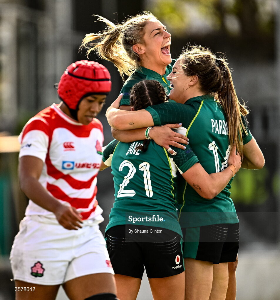 27 September 2026; Béibhinn Parsons of Ireland celebrates with teammates Erin King, left, and Emily Lane, 21, after scoring her second and their side's fifth try, becoming Ireland's record try scorer, during the WXV Global Series match between Ireland and Japan at Dexcom Stadium in Galway. Photo by Shauna Clinton/Sportsfile