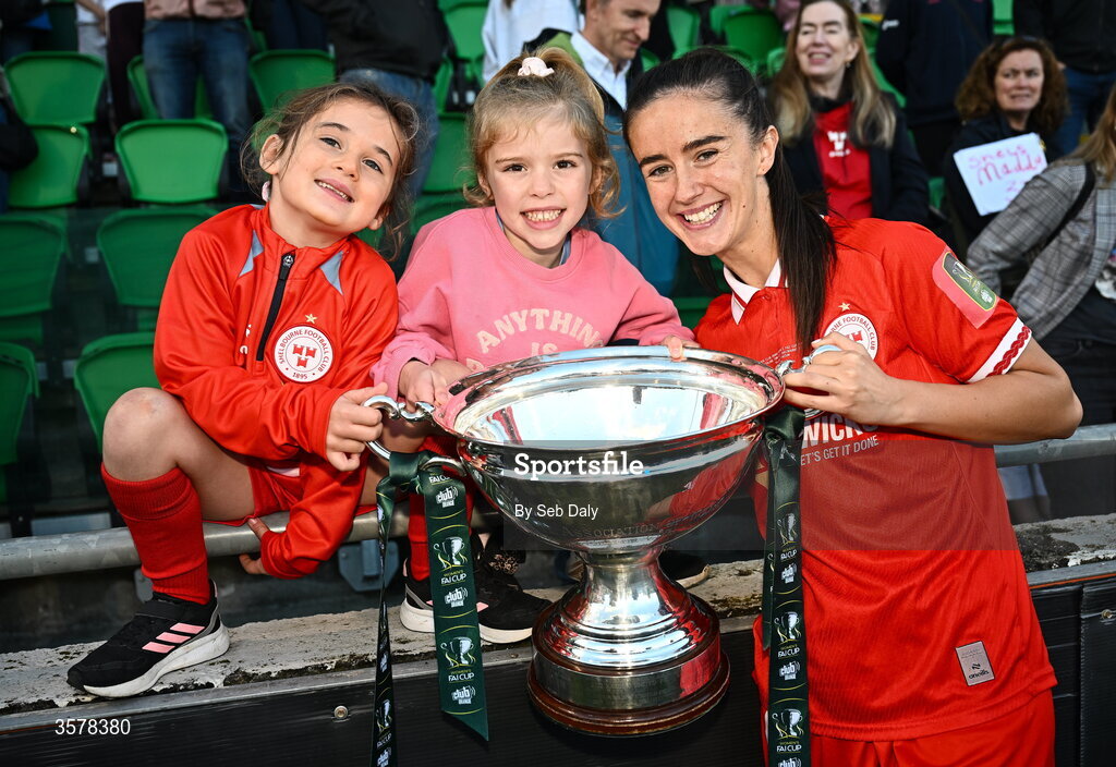 27 September 2026; Alex Kavanagh of Shelbourne celebrates with supporters and the cup after her side's victory in the 2026 Club Orange Women's FAI Cup final between Athlone Town and Shelbourne at Tallaght Stadium in Dublin. Photo by Seb Daly/Sportsfile