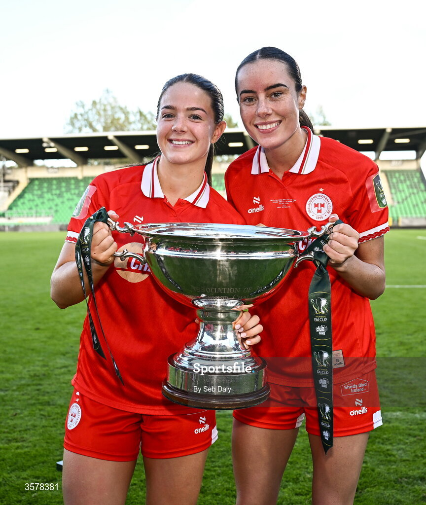27 September 2026; Shelbourne players Becky Watkins, left, and Aoife Kelly with the cup after their side's victory in the 2026 Club Orange Women's FAI Cup final between Athlone Town and Shelbourne at Tallaght Stadium in Dublin. Photo by Seb Daly/Sportsfile
