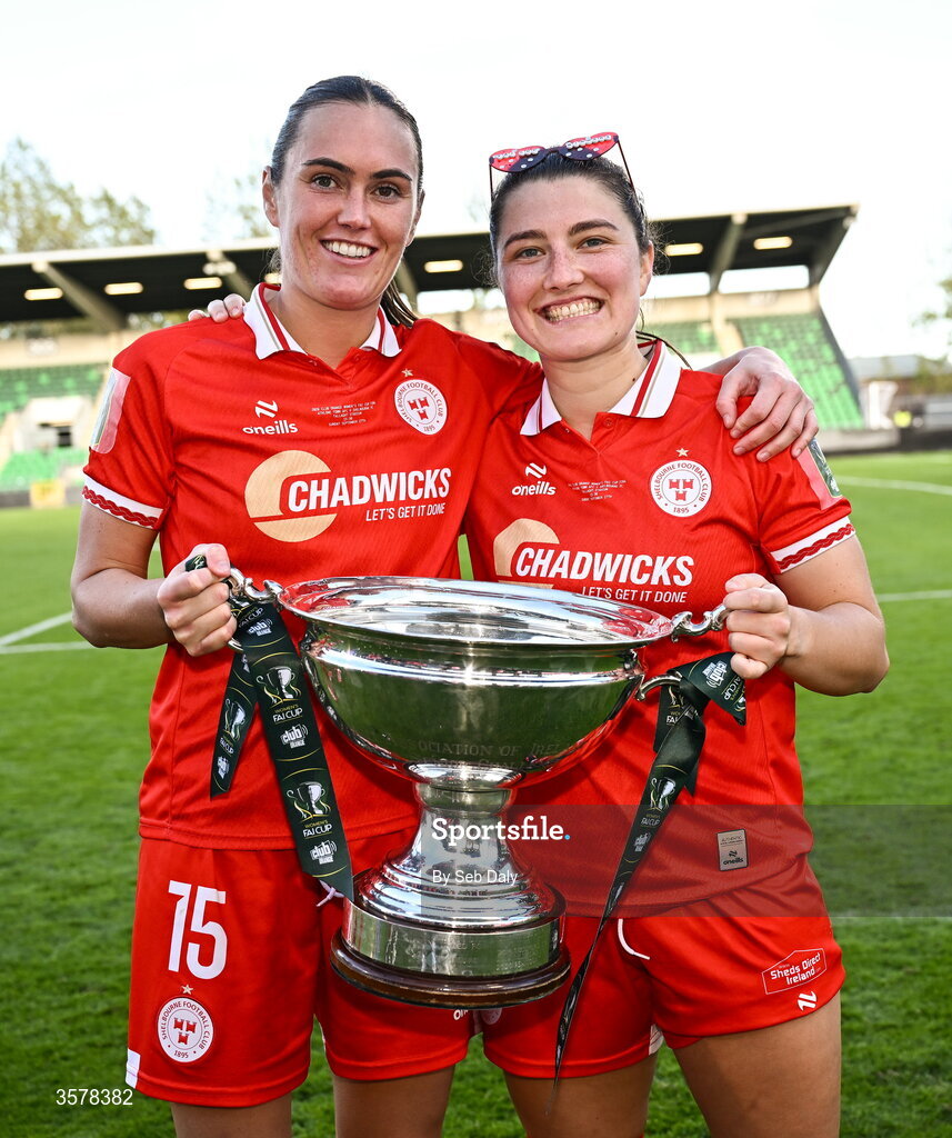 27 September 2026; Shelbourne players Jess Gargan, left, and Keeva Keenan with the cup after their side's victory in the 2026 Club Orange Women's FAI Cup final between Athlone Town and Shelbourne at Tallaght Stadium in Dublin. Photo by Seb Daly/Sportsfile