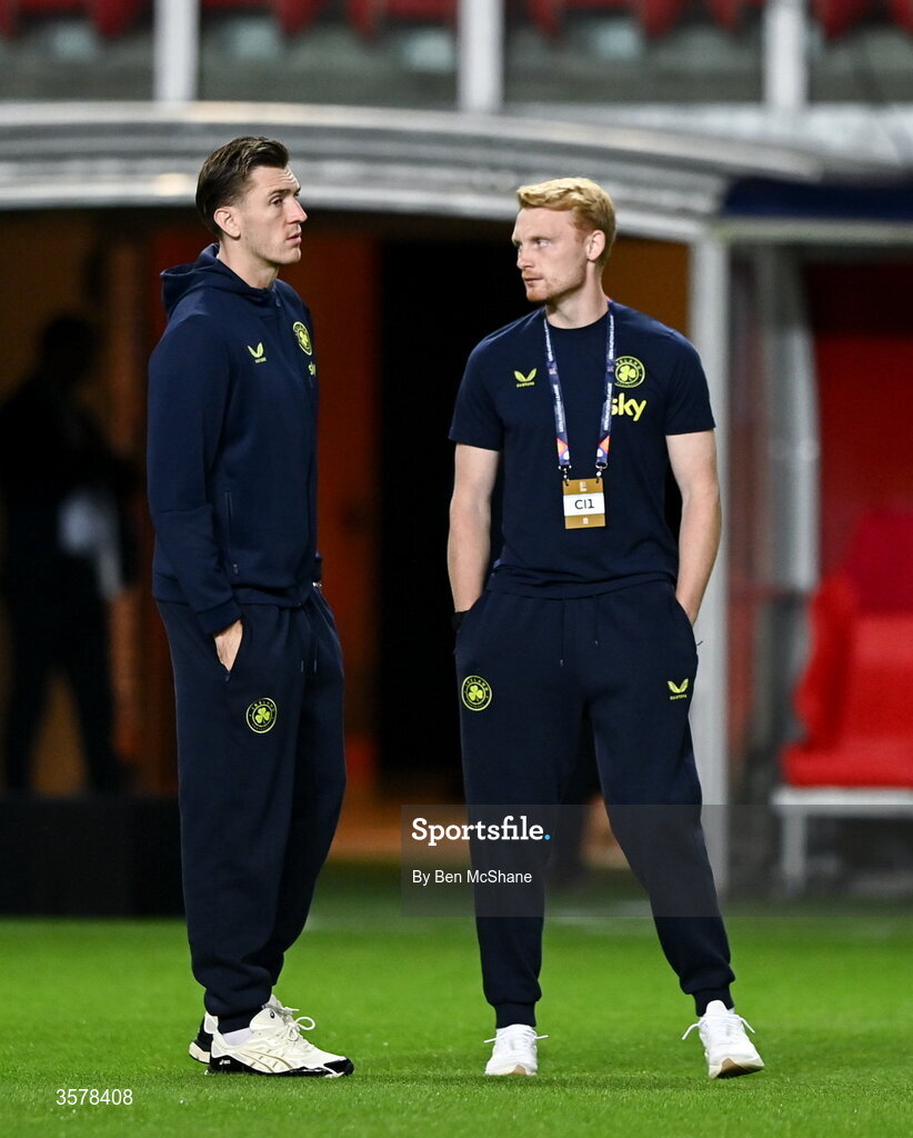 27 September 2026; Jimmy Dunne, left, and Liam Scales of Republic of Ireland walk the pitch before the UEFA Nations League B match between Israel and the Republic of Ireland at Nagyerdei Stadion in Debrecen, Hungary. Photo by Ben McShane/Sportsfile