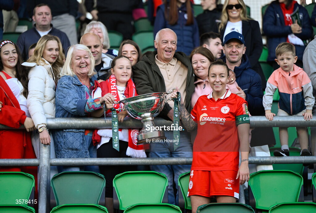 27 September 2026; Pearl Slattery of Shelbourne celebrates with the trophy and supporters after winning the 2026 Club Orange Women's FAI Cup final between Athlone Town and Shelbourne at Tallaght Stadium in Dublin. Photo by Eakin Howard/Sportsfile