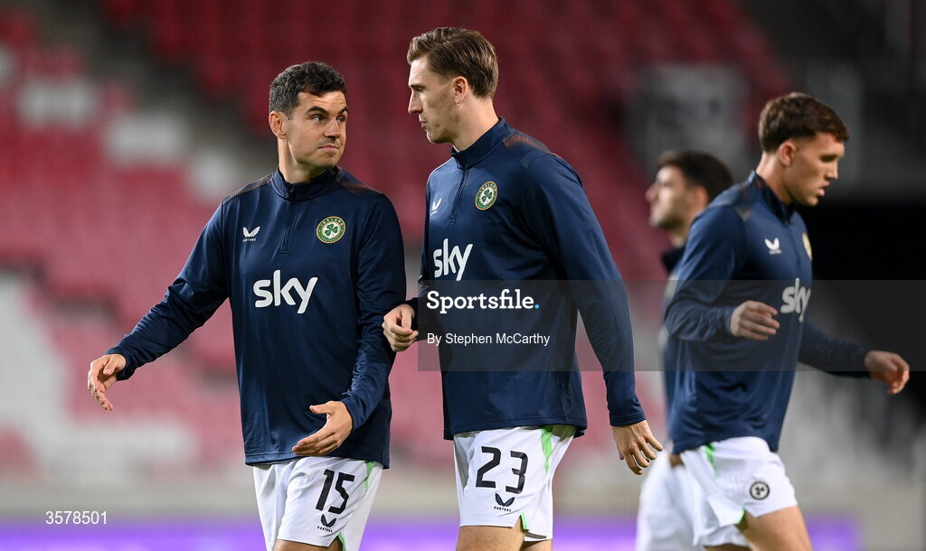 27 September 2026; John Egan, left, and Jimmy Dunne of Republic of Ireland warm up before the UEFA Nations League B match between Israel and the Republic of Ireland at Nagyerdei Stadion in Debrecen, Hungary. Photo by Stephen McCarthy/Sportsfile