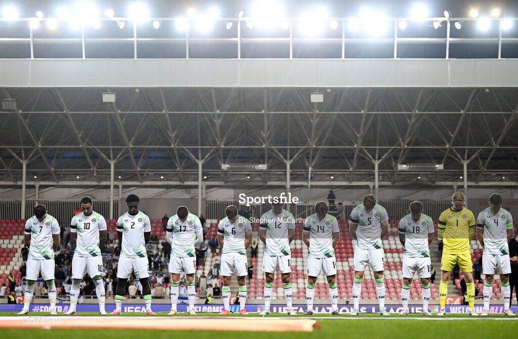 27 September 2026; The Republic of Ireland team, wearing black armbands in recognition for all the lives lost in the conflict in Gaza, bow their heads during the Israeli national anthem before the UEFA Nations League B match between Israel and the Republic of Ireland at Nagyerdei Stadion in Debrecen, Hungary. Photo by Stephen McCarthy/Sportsfile