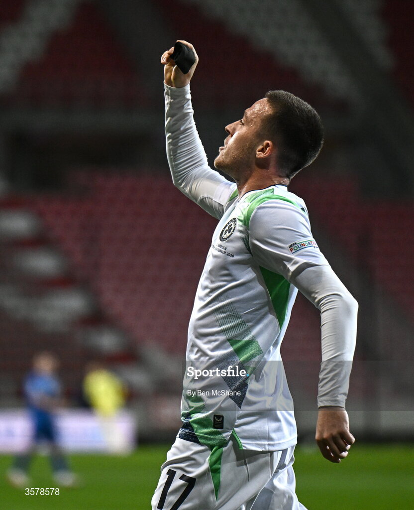 27 September 2026; Jack Moylan of Republic of Ireland, holds up his black armband towards Israeli supporters, worn in recognition for all the lives lost in the conflict in Gaza, after scoring his side's third goal during the UEFA Nations League B match between Israel and the Republic of Ireland at Nagyerdei Stadion in Debrecen, Hungary. Photo by Ben McShane/Sportsfile
