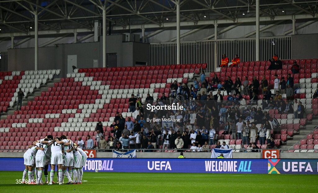27 September 2026; The Republic of Ireland team huddle in front of Israeli supporters before the UEFA Nations League B match between Israel and the Republic of Ireland at Nagyerdei Stadion in Debrecen, Hungary. Photo by Ben McShane/Sportsfile