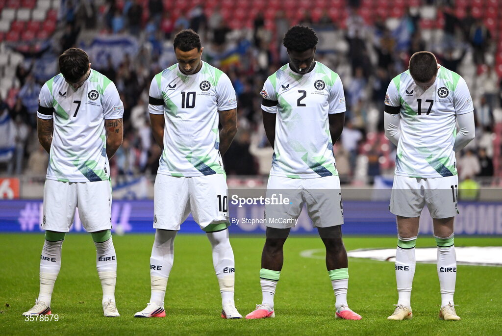27 September 2026; Republic of Ireland, players, from left, Troy Parrott, Adam Idah, James Abankwah and Jack Moylan, wearing black armbands in recognition for all the lives lost in the conflict in Gaza, bow their heads during the Israeli national anthem before the UEFA Nations League B match between Israel and the Republic of Ireland at Nagyerdei Stadion in Debrecen, Hungary. Photo by Stephen McCarthy/Sportsfile