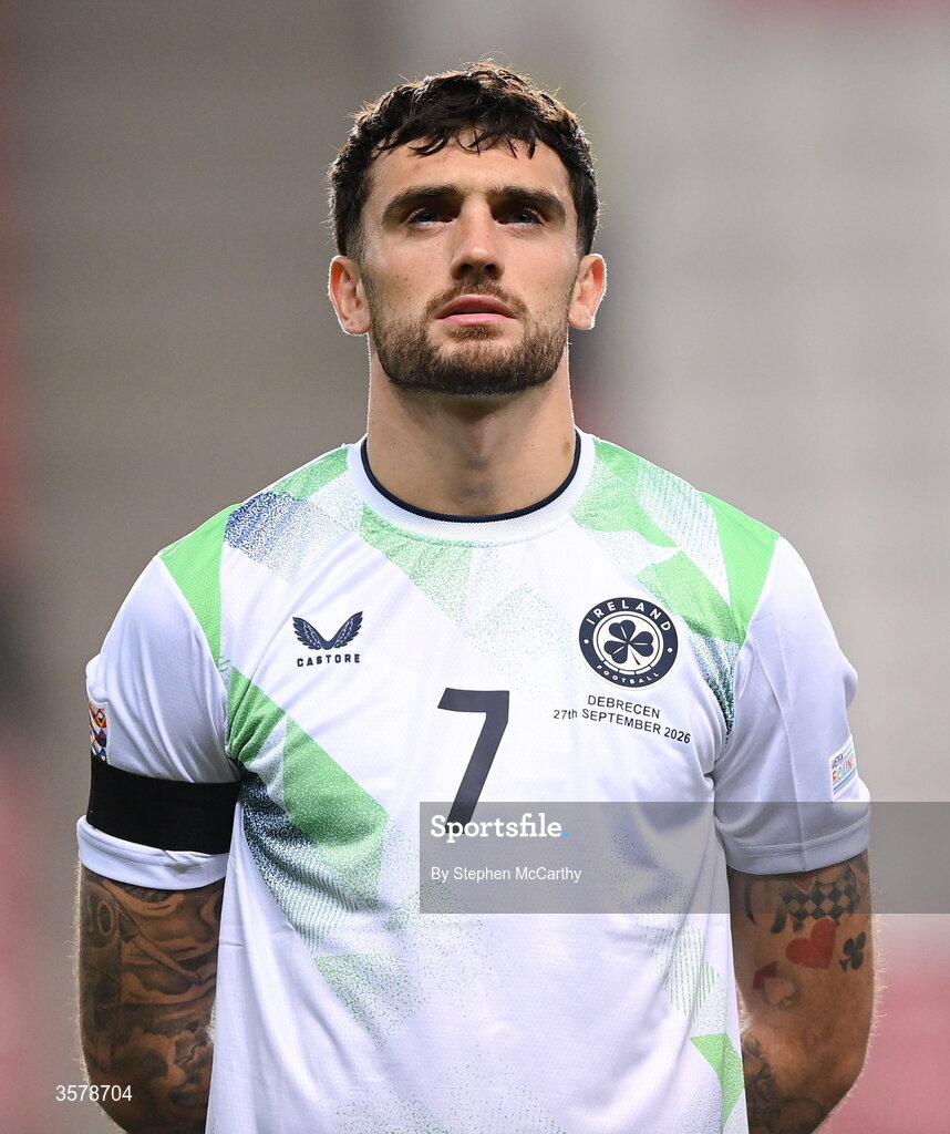 27 September 2026; Troy Parrott of Republic of Ireland, wearing a black armband in recognition for all the lives lost in the conflict in Gaza, stands for the national anthem before the UEFA Nations League B match between Israel and the Republic of Ireland at Nagyerdei Stadion in Debrecen, Hungary. Photo by Stephen McCarthy/Sportsfile