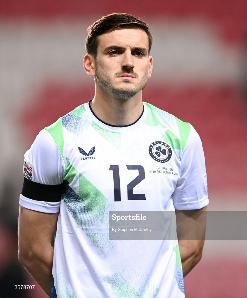 27 September 2026; Liam Kitching of Republic of Ireland, wearing a black armband in recognition for all the lives lost in the conflict in Gaza, stands for the national anthem before the UEFA Nations League B match between Israel and the Republic of Ireland at Nagyerdei Stadion in Debrecen, Hungary. Photo by Stephen McCarthy/Sportsfile