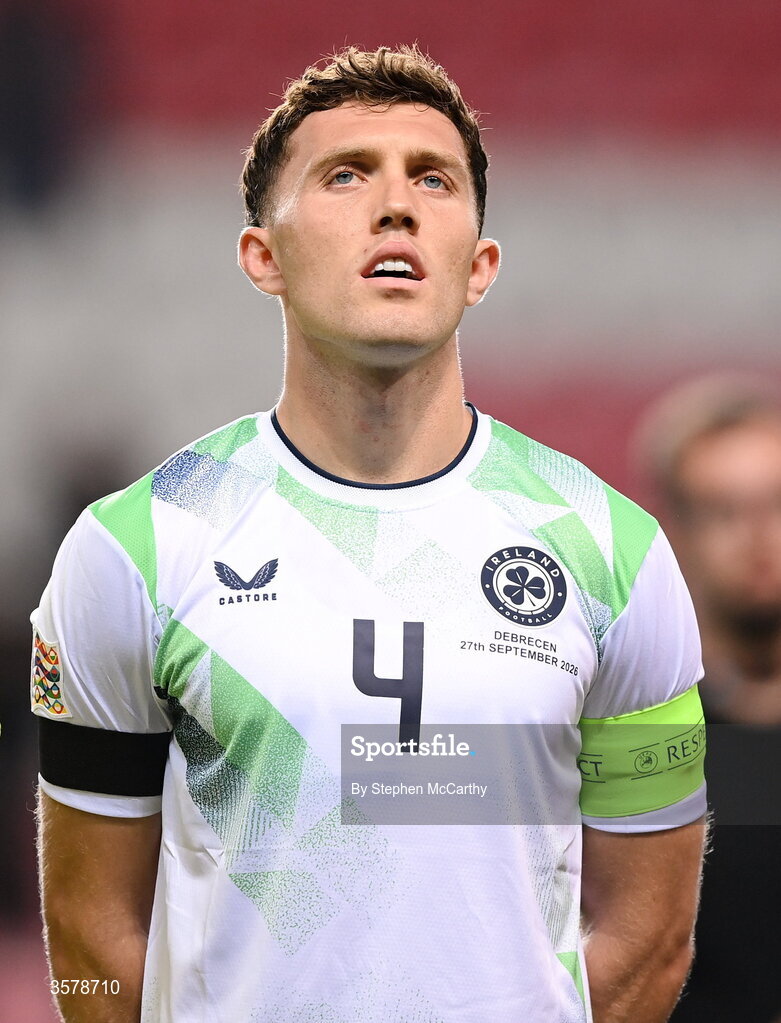 27 September 2026; Republic of Ireland captain Dara O'Shea, wearing a black armband in recognition for all the lives lost in the conflict in Gaza, stands for the national anthem before the UEFA Nations League B match between Israel and the Republic of Ireland at Nagyerdei Stadion in Debrecen, Hungary. Photo by Stephen McCarthy/Sportsfile