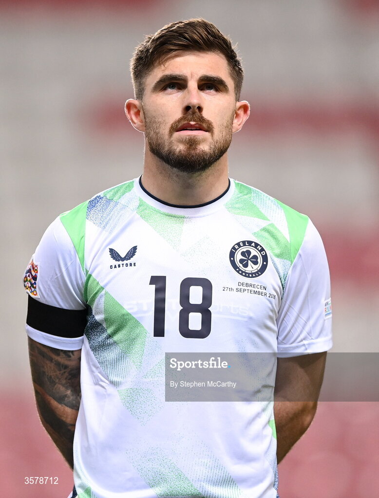 27 September 2026; Ryan Manning of Republic of Ireland, wearing a black armband in recognition for all the lives lost in the conflict in Gaza, stands for the national anthem before the UEFA Nations League B match between Israel and the Republic of Ireland at Nagyerdei Stadion in Debrecen, Hungary. Photo by Stephen McCarthy/Sportsfile