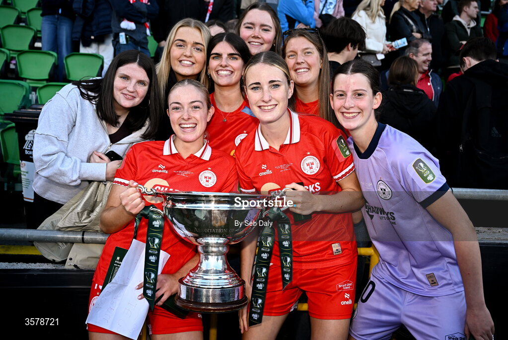 27 September 2026; Shelbourne players, from left, Maddy McKinley, Lara Whelan, and goalkeeper Jenna Willoughby with supporter after the 2026 Club Orange Women's FAI Cup final between Athlone Town and Shelbourne at Tallaght Stadium in Dublin. Photo by Seb Daly/Sportsfile