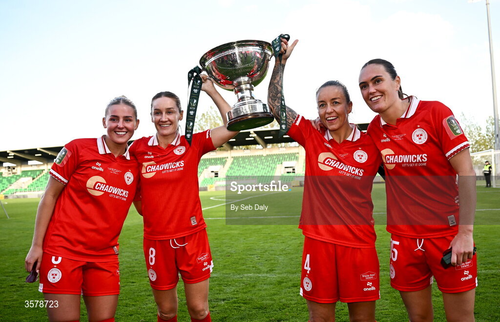 27 September 2026; Shelbourne players, from left, Nia Hannon, Rachel Graham, Pearl Slattery, and Jess Gargan, with the trophy after the 2026 Club Orange Women's FAI Cup final between Athlone Town and Shelbourne at Tallaght Stadium in Dublin. Photo by Seb Daly/Sportsfile