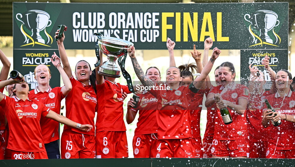 27 September 2026; Shelbourne captain Pearl Slattery and teammate Alex Kavanagh lift the trophy after their side's victory in the 2026 Club Orange Women's FAI Cup final between Athlone Town and Shelbourne at Tallaght Stadium in Dublin. Photo by Seb Daly/Sportsfile
