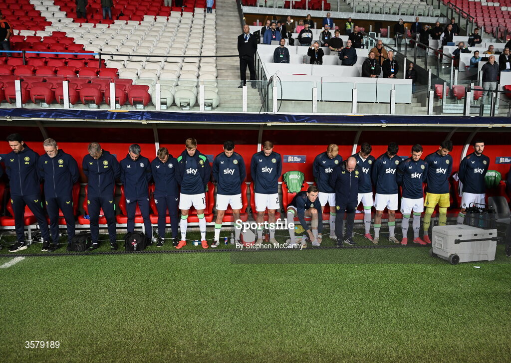 27 September 2026; The Republic of Ireland staff and substitutes during the Israeli national anthem before the UEFA Nations League B match between Israel and the Republic of Ireland at Nagyerdei Stadion in Debrecen, Hungary.  Photo by Stephen McCarthy/Sportsfile