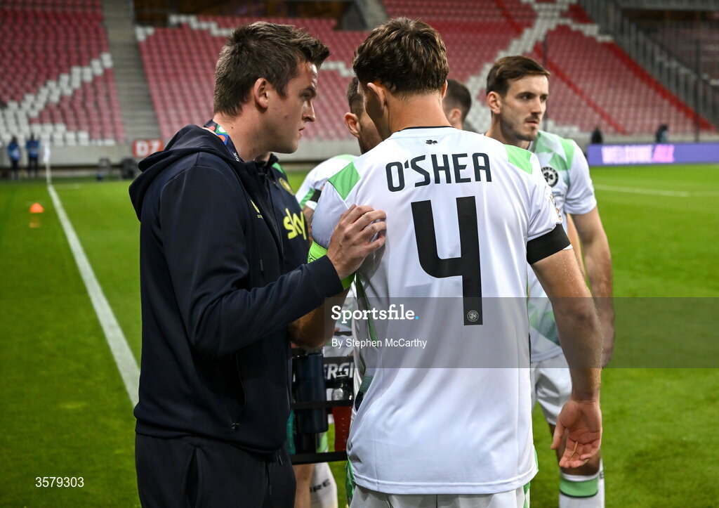27 September 2026; Republic of Ireland communications manager Kieran Crowley speaks to captain Dara O'Shea before the UEFA Nations League B match between Israel and the Republic of Ireland at Nagyerdei Stadion in Debrecen, Hungary. Photo by Stephen McCarthy/Sportsfile