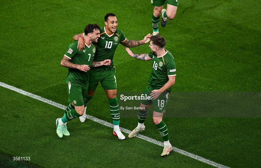 1 October 2026; Troy Parrott of Republic of Ireland, left, celebrates with team-mates Adam Idah, centre, and Ryan Manning after scoring their side's first goal during the UEFA Nations League B match between the Republic of Ireland and Austria at the Aviva Stadium in Dublin. Photo by Sam Barnes/Sportsfile
