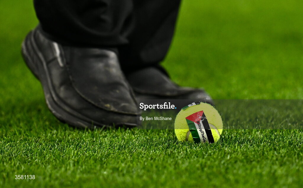 1 October 2026; A member of security clears a tennis ball, which was thrown onto the pitch in protest, during the UEFA Nations League B match between the Republic of Ireland and Austria at the Aviva Stadium in Dublin. Photo by Ben McShane/Sportsfile