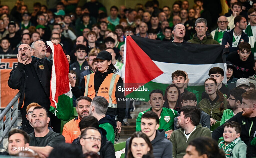 1 October 2026; Protesters hold up a Palestine flag during the UEFA Nations League B match between the Republic of Ireland and Austria at the Aviva Stadium in Dublin. Photo by Ben McShane/Sportsfile