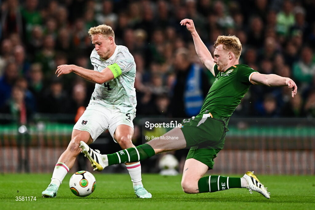 1 October 2026; Xaver Schlager of Austria is tackled by Liam Scales of Republic of Ireland during the UEFA Nations League B match between the Republic of Ireland and Austria at the Aviva Stadium in Dublin. Photo by Ben McShane/Sportsfile