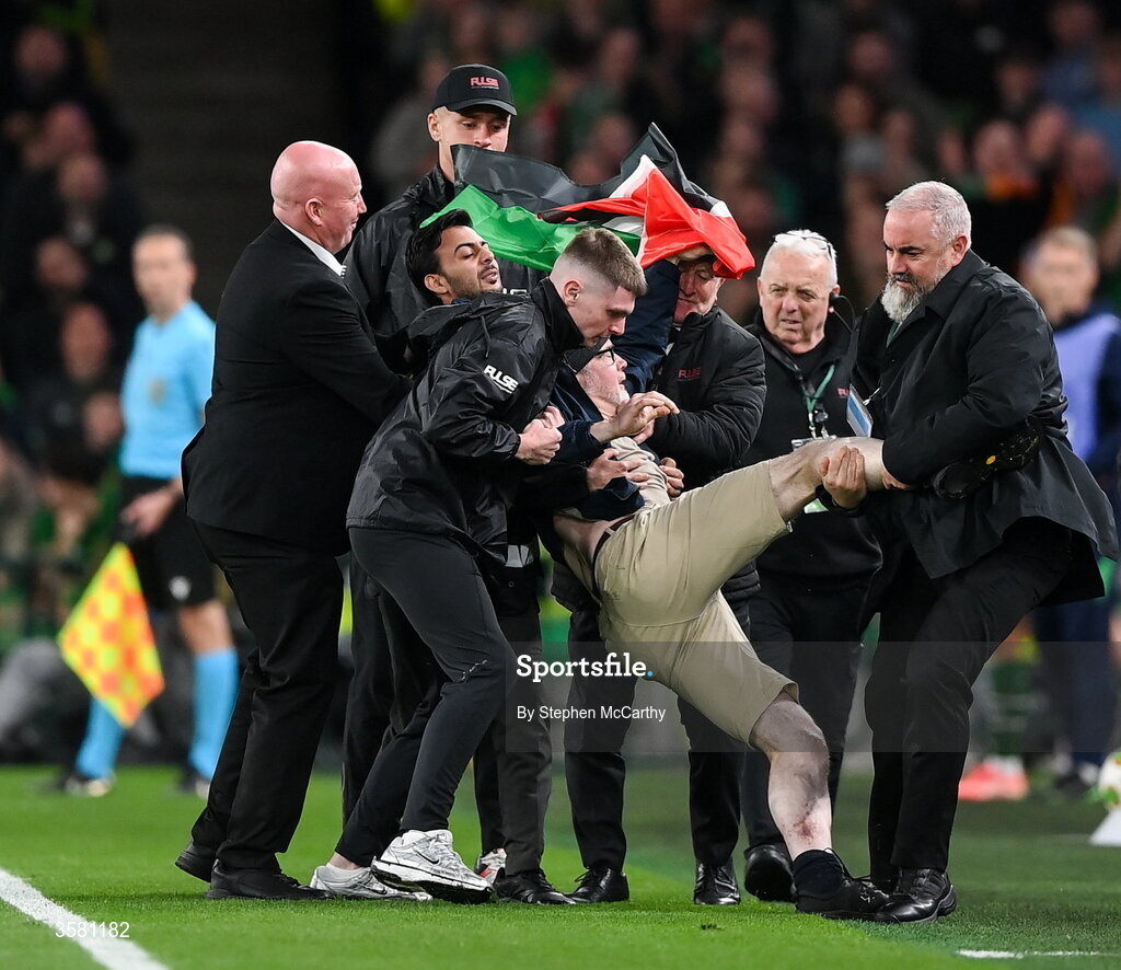 1 October 2026; A protestor is removed from the pitch during the UEFA Nations League B match between the Republic of Ireland and Austria at the Aviva Stadium in Dublin. Photo by Stephen McCarthy/Sportsfile