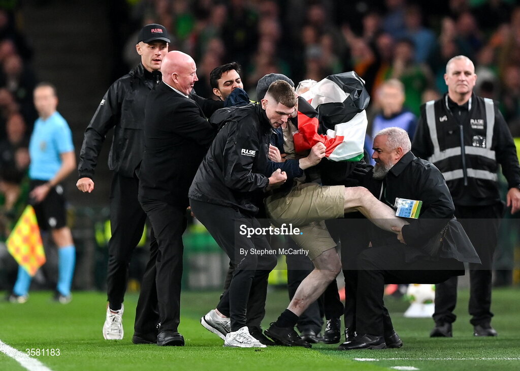 1 October 2026; A protestor is removed from the pitch during the UEFA Nations League B match between the Republic of Ireland and Austria at the Aviva Stadium in Dublin. Photo by Stephen McCarthy/Sportsfile