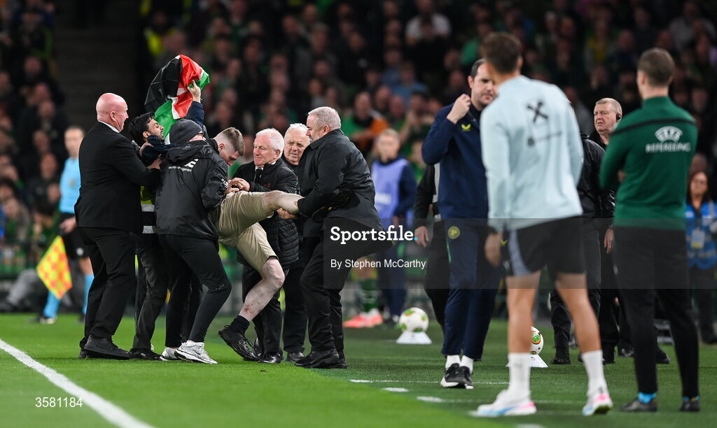 1 October 2026; A protestor is removed from the pitch during the UEFA Nations League B match between the Republic of Ireland and Austria at the Aviva Stadium in Dublin. Photo by Stephen McCarthy/Sportsfile