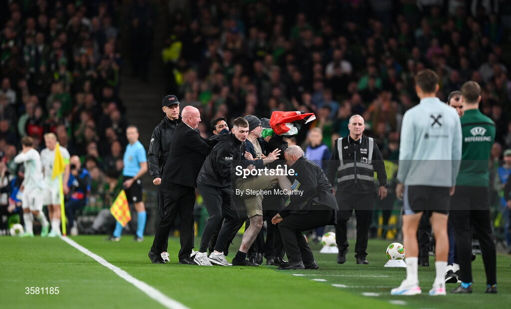 1 October 2026; A protestor is removed from the pitch during the UEFA Nations League B match between the Republic of Ireland and Austria at the Aviva Stadium in Dublin. Photo by Stephen McCarthy/Sportsfile