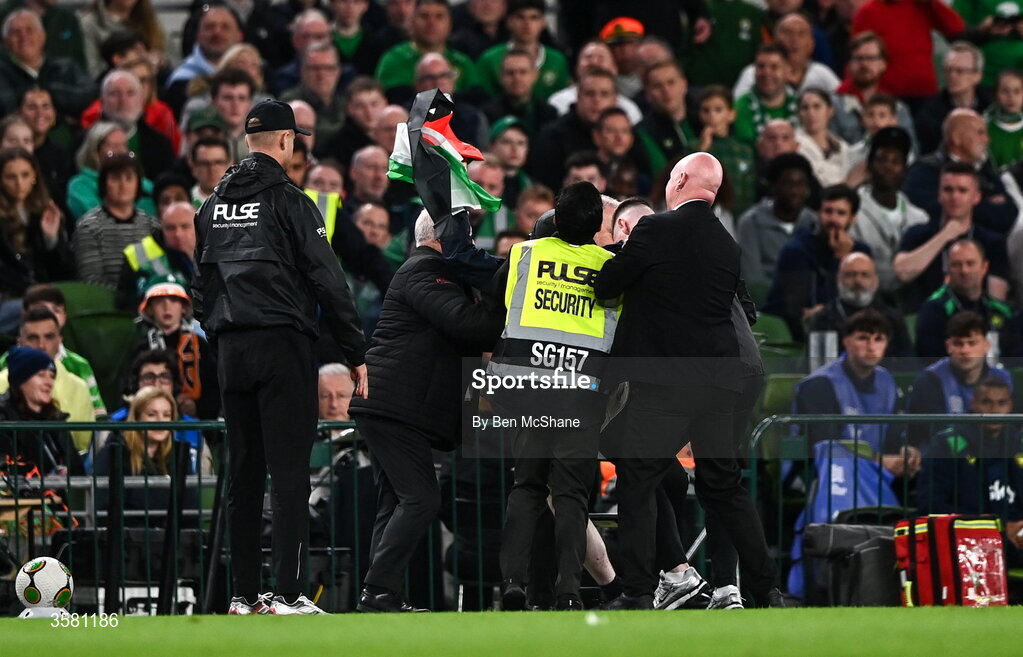 1 October 2026; A protestor is removed from the pitch during the UEFA Nations League B match between the Republic of Ireland and Austria at the Aviva Stadium in Dublin. Photo by Ben McShane/Sportsfile