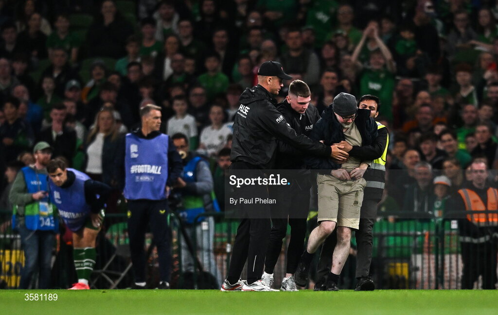1 October 2026; A protestor is removed from the pitch during the UEFA Nations League B match between the Republic of Ireland and Austria at the Aviva Stadium in Dublin. Photo by Paul Phelan/Sportsfile