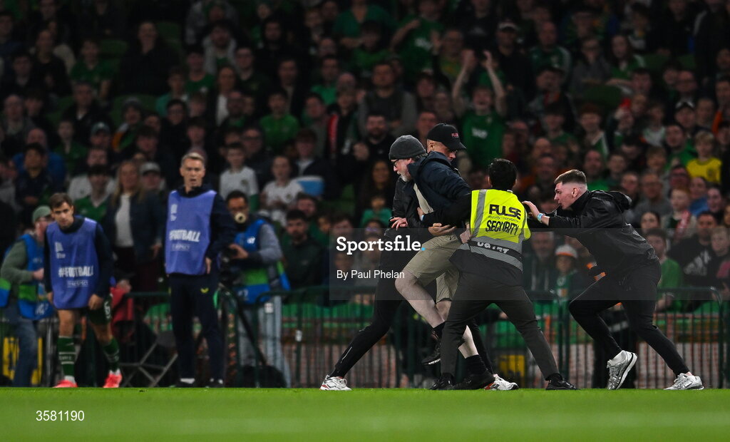 1 October 2026; A protestor is removed from the pitch during the UEFA Nations League B match between the Republic of Ireland and Austria at the Aviva Stadium in Dublin. Photo by Paul Phelan/Sportsfile