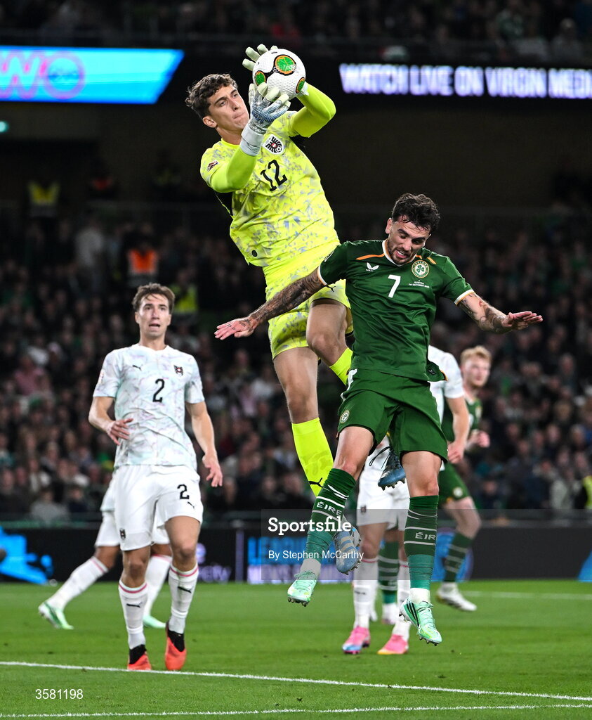 1 October 2026; Austria goalkeeper Florian Wiegele gathers possession ahead of Troy Parrott of Republic of Ireland during the UEFA Nations League B match between the Republic of Ireland and Austria at the Aviva Stadium in Dublin. Photo by Stephen McCarthy/Sportsfile