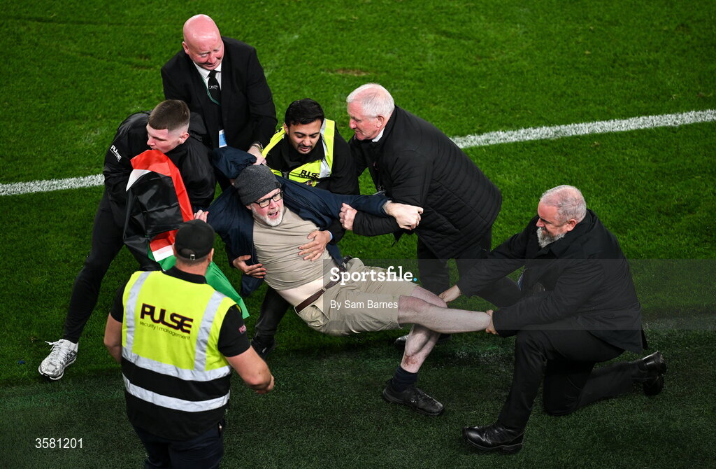 1 October 2026; A protestor is removed from the pitch during the UEFA Nations League B match between the Republic of Ireland and Austria at the Aviva Stadium in Dublin. Photo by Sam Barnes/Sportsfile