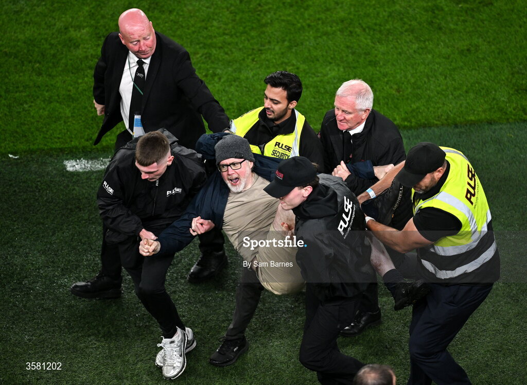 1 October 2026; A protestor is removed from the pitch during the UEFA Nations League B match between the Republic of Ireland and Austria at the Aviva Stadium in Dublin. Photo by Sam Barnes/Sportsfile