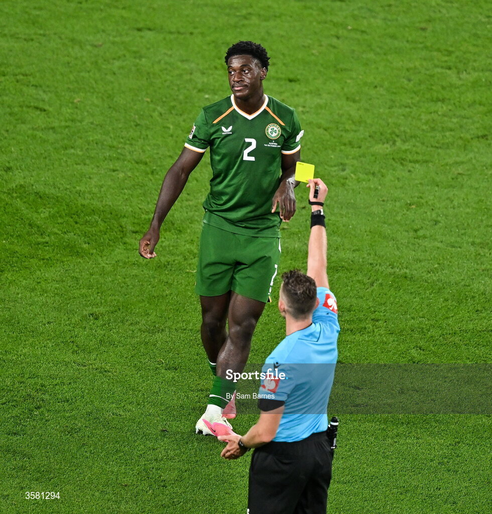 1 October 2026; James Abankwah of Republic of Ireland is shown a yellow card by referee Allard Lindhout which subsequently results in his suspension from Republic of Ireland's next match during the UEFA Nations League B match between the Republic of Ireland and Austria at the Aviva Stadium in Dublin. Photo by Sam Barnes/Sportsfile