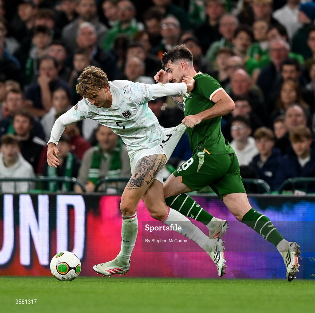 1 October 2026; Stefan Posch of Austria is tackled by Ryan Manning of Republic of Ireland during the UEFA Nations League B match between the Republic of Ireland and Austria at the Aviva Stadium in Dublin. Photo by Stephen McCarthy/Sportsfile