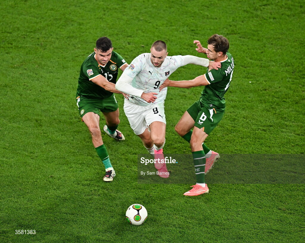 1 October 2026; Sasa Kalajdzic of Austria in action against John Egan, left, and Jayson Molumby of Republic of Ireland during the UEFA Nations League B match between the Republic of Ireland and Austria at the Aviva Stadium in Dublin. Photo by Sam Barnes/Sportsfile