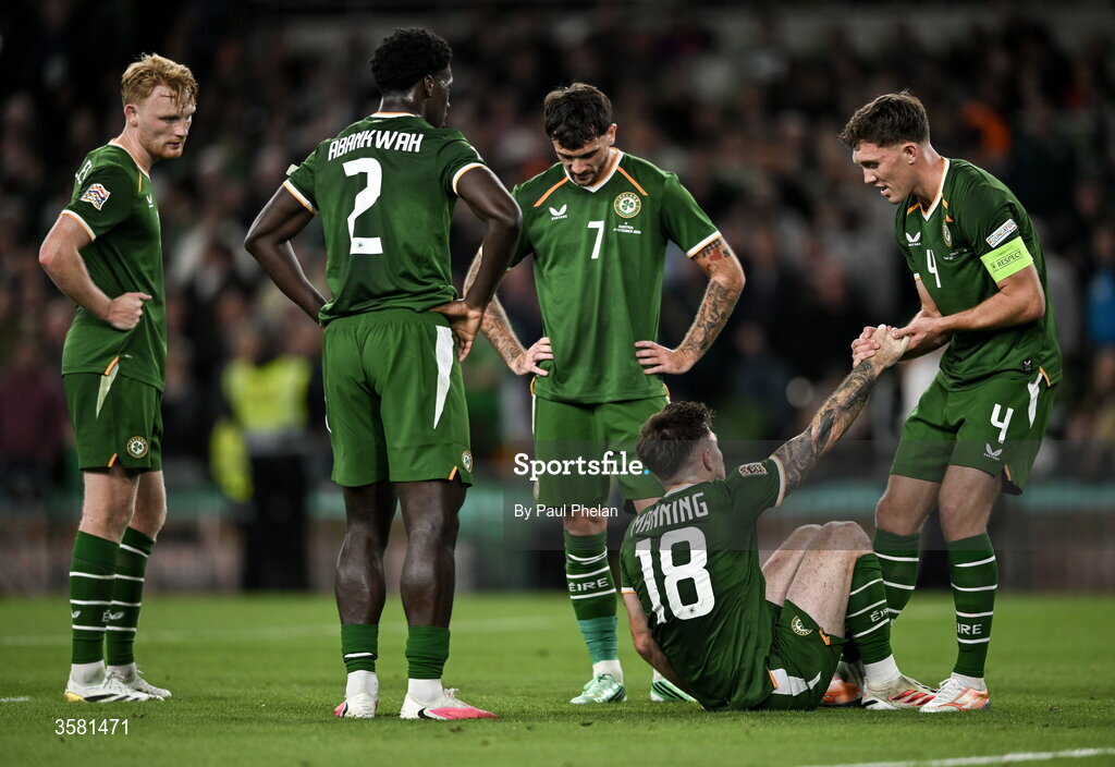 1 October 2026; Ryan Manning of Republic of Ireland is helped off the ground by Dara O'Shea after he wins a penalty during the UEFA Nations League B match between the Republic of Ireland and Austria at the Aviva Stadium in Dublin. Photo by Paul Phelan/Sportsfile