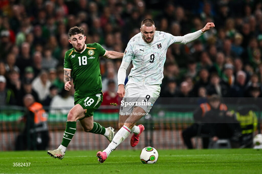 1 October 2026; Sasa Kalajdzic of Austria and Ryan Manning of Republic of Ireland during the UEFA Nations League B match between the Republic of Ireland and Austria at the Aviva Stadium in Dublin. Photo by Ben McShane/Sportsfile