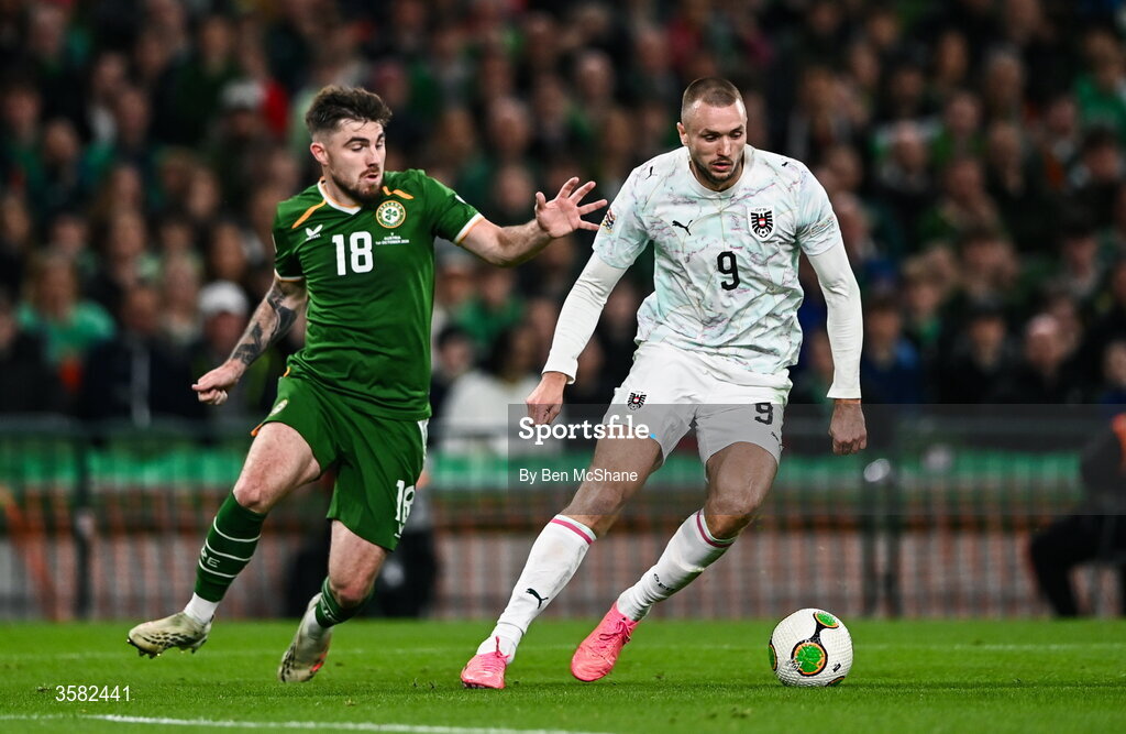 1 October 2026; Sasa Kalajdzic of Austria and Ryan Manning of Republic of Ireland during the UEFA Nations League B match between the Republic of Ireland and Austria at the Aviva Stadium in Dublin. Photo by Ben McShane/Sportsfile